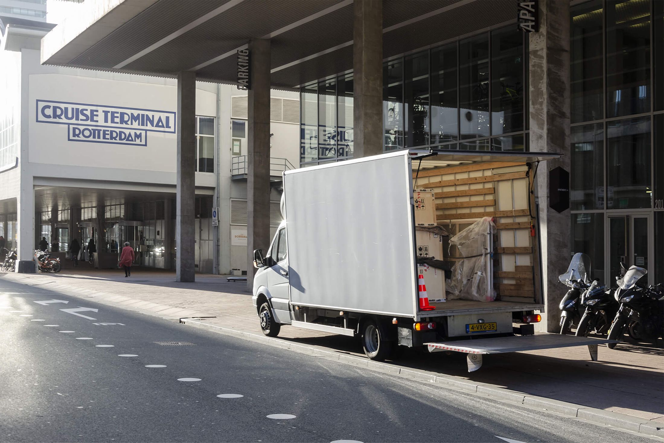 Exhibition Continues (2019) by Melle Nieling, a truck with art shipping crates is standing by the Cruise Terminal in Rotterdam during Art Rotterdam 2019