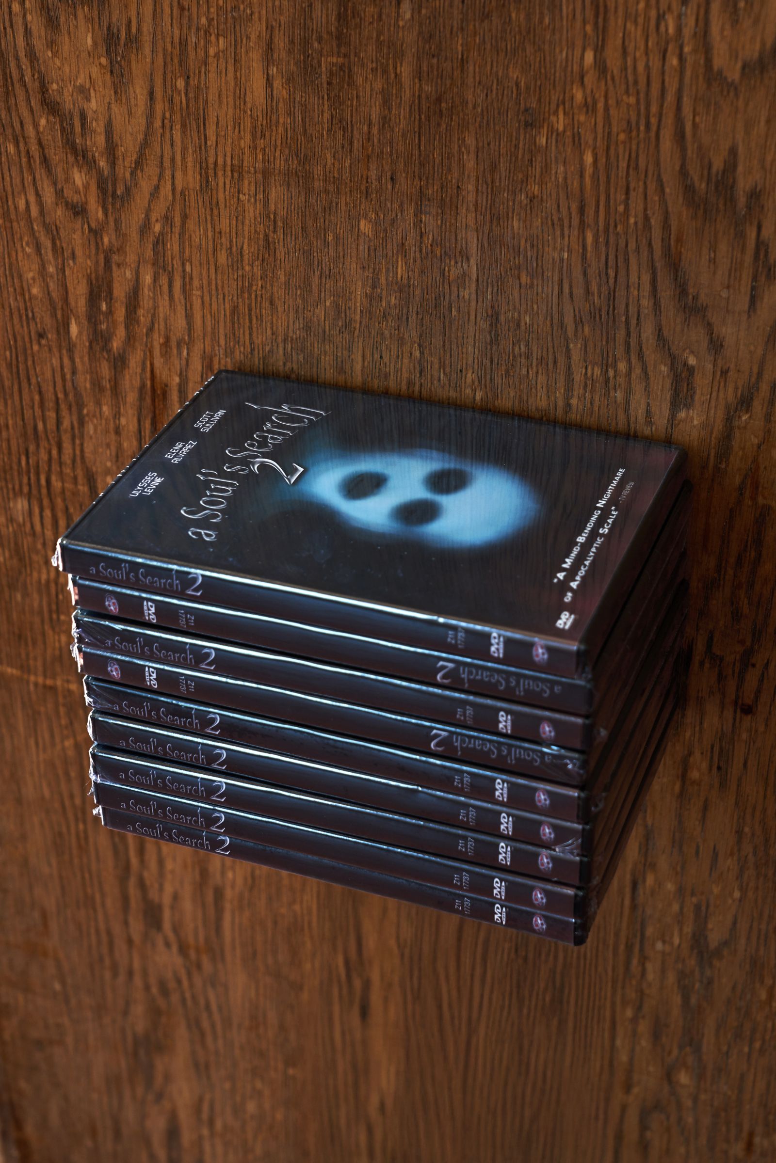 Stack of DVD cases titled 