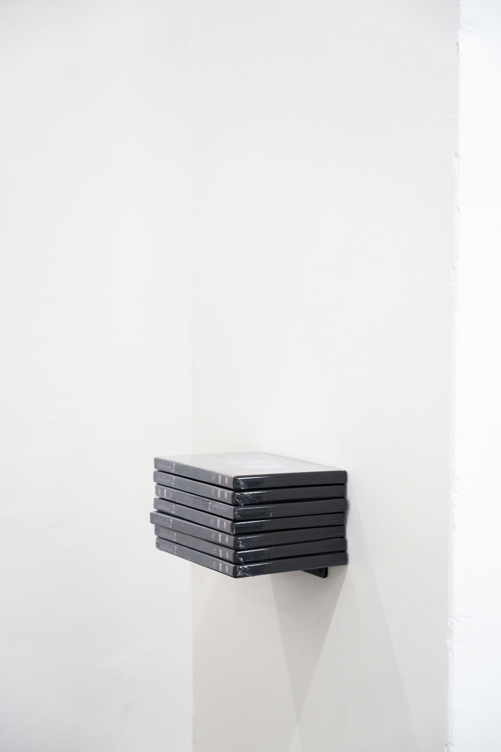 Stack of DVD cases titled 