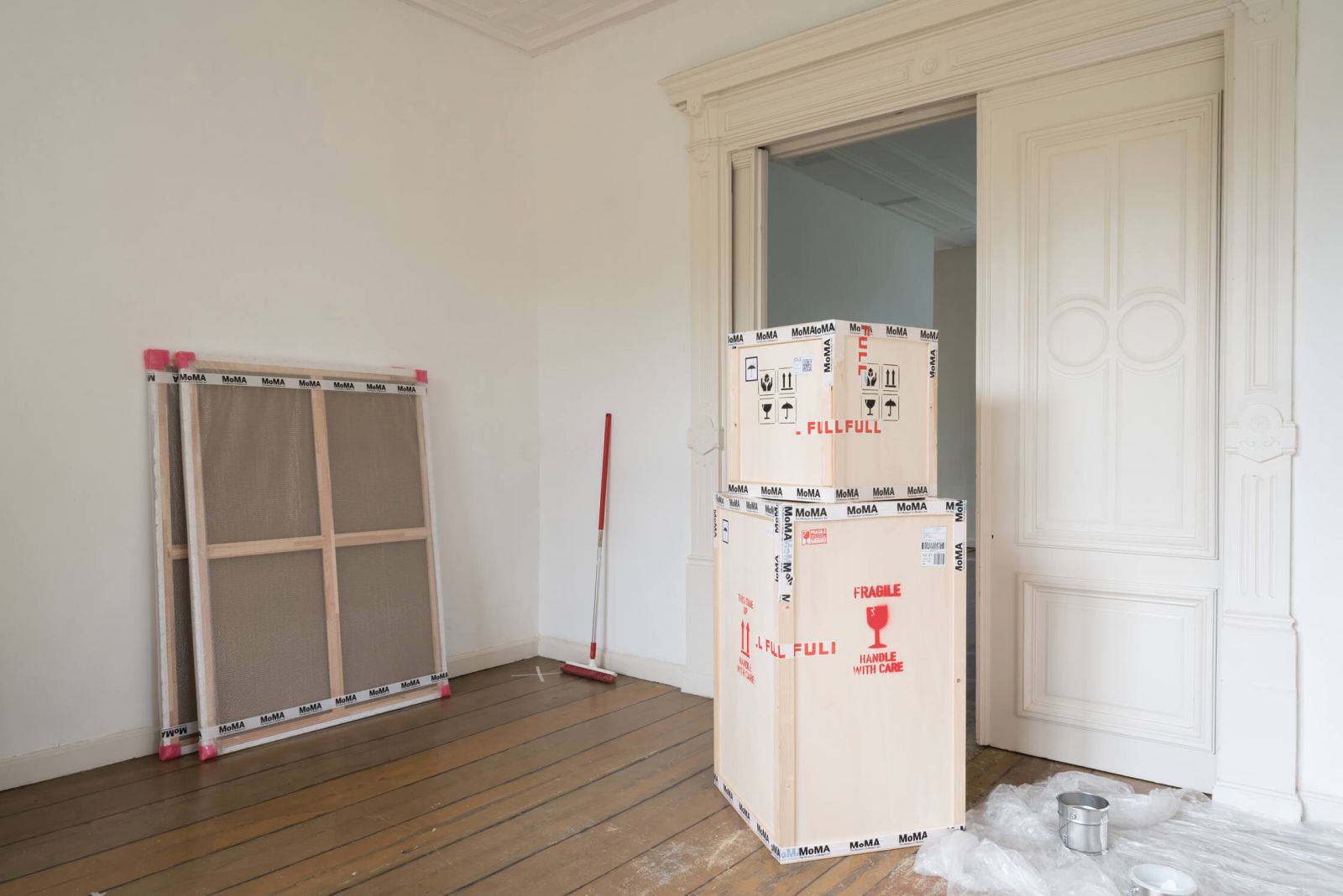 View of the second room of MoMA at the Bank Presents (2018), showing some crates